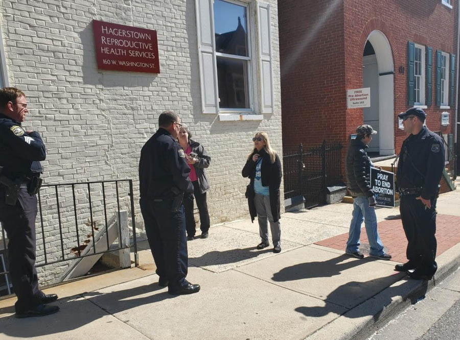 Wanda King is confronted by police at the Hagerstown Reproductive Health abortion facility 