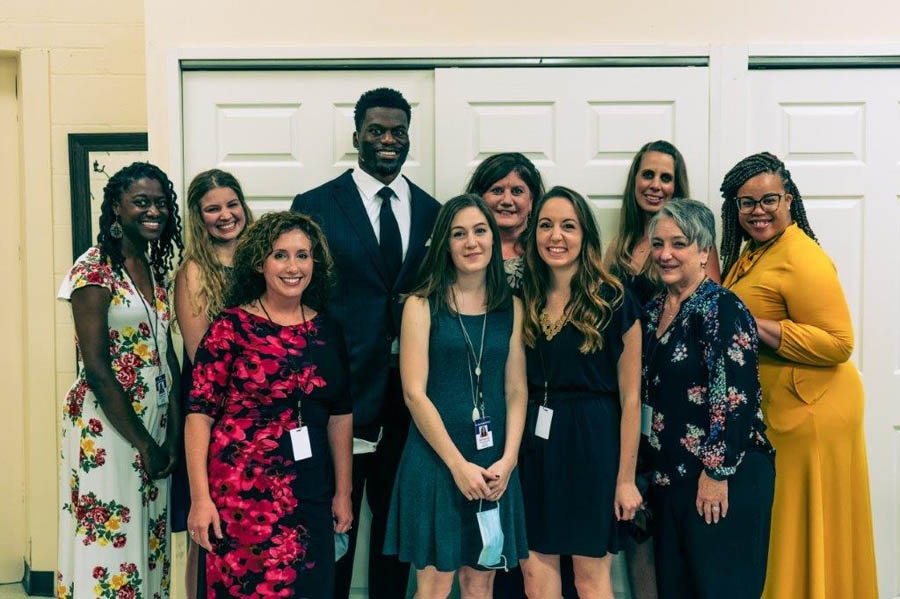 Benjamin Watson with New Hope Family Services staff