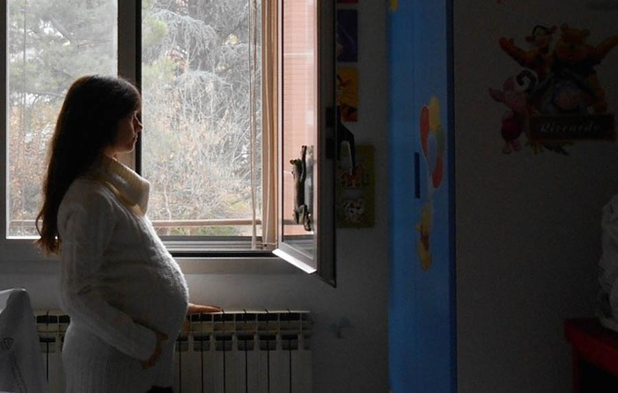 Pregnant mom in the baby room at True Care Women’s Resource Center 