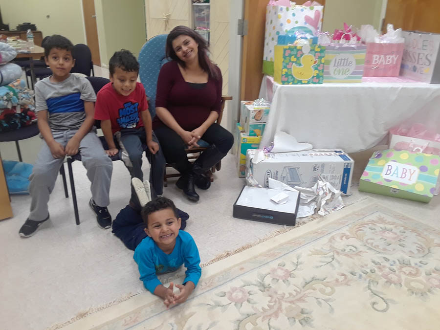 Samantha and her three boys at her recent baby shower, hosted by Abundant Hope PRC in Attleboro, Mass.