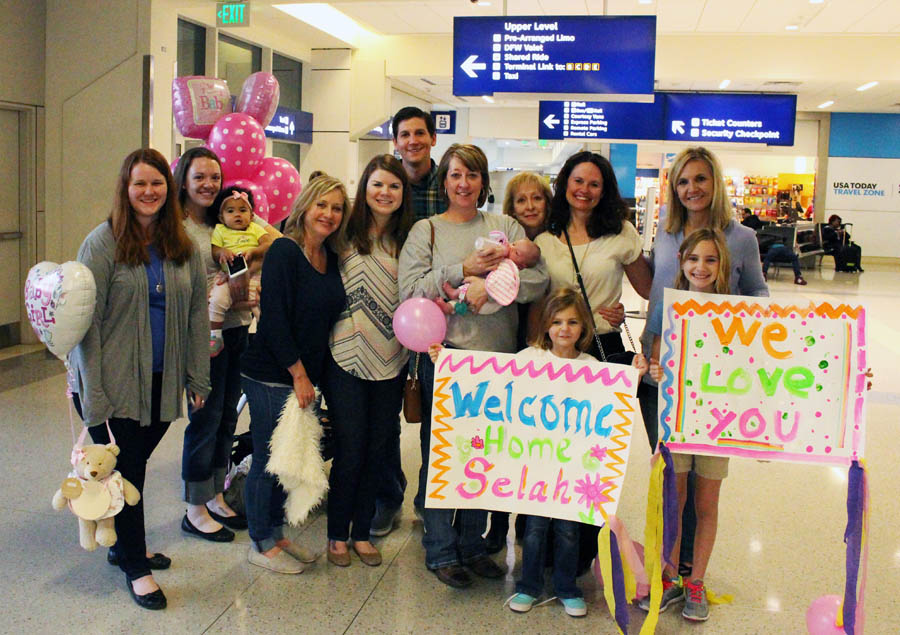 Cameron and Alisha's family and friends greet their family of three for the first time in early February. 