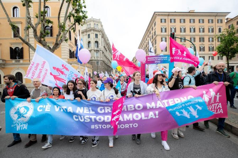 Members of an Italian pro-life and pro-family organization marched in the "Demonstration for Life" May 20, 2023, with a banner saying "There's life in the mother's womb. Let's care for it. #stopabortion"