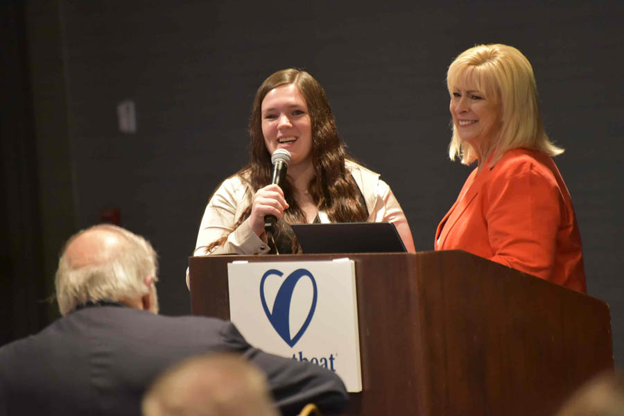 APR mom Cassidy tells her story at  a gathering for Heartbeat International's 2023 Annual Pregnancy Help Conference