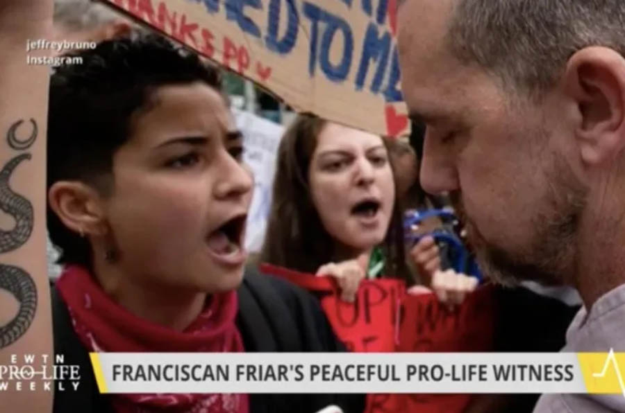 Fr. Fidelis Moscinski, CFR (right) encounters protesters during the July 10 "Witness for Life" prayer procession in Brooklyn.