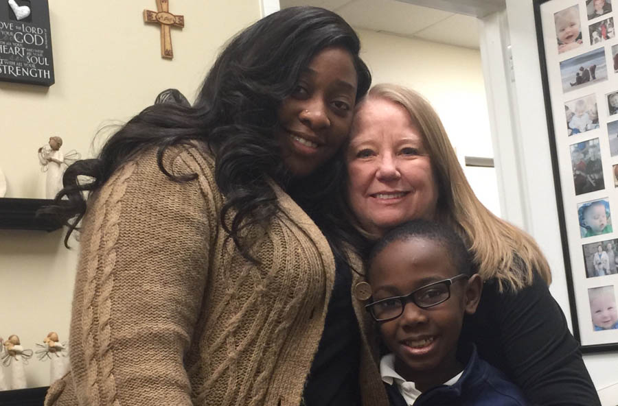 Wendy Maxey with Adriane and her son, Andrew, who she rescued from abortion 7 years ago