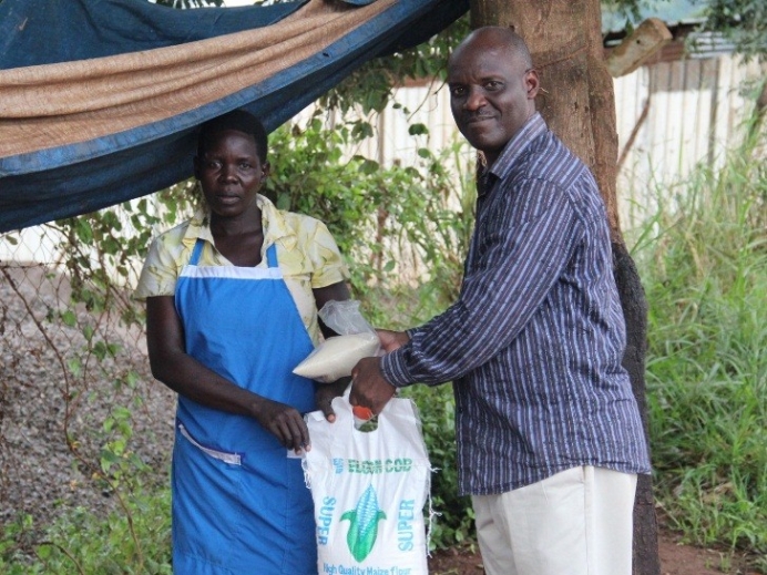 Stephen Wabomba delivers food to supplement what Naigaga, single mother of six children, earns by roasting cassava
