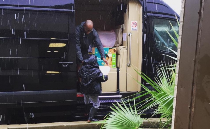Volunteers with Houston Pregnancy Help Center unload material aid during Tropical Storm Harvey