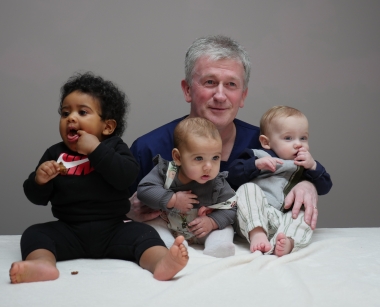 Dr. Dermot Kearney with three babies whose mothers he treated with Abortion Pill Reversal