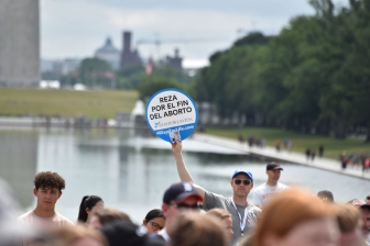 A man holds a sign at the National Celebrate Life Day rally June 24, 2023, in Washington D.C. commemorating the first anniversary of the Dobb decision.